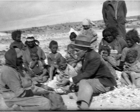 Ernie Sherman communicating with some local aboriginals at Coober Pedy, date Unknown, Thought to be Circa 1930’s